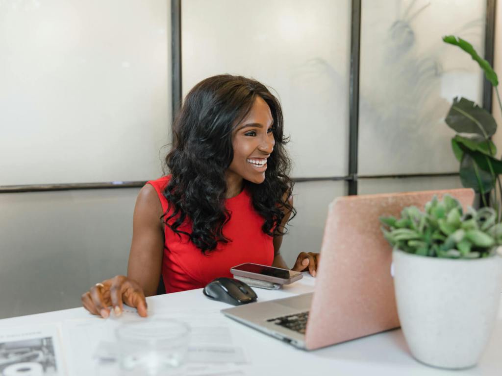 Black woman having a chat on her computer